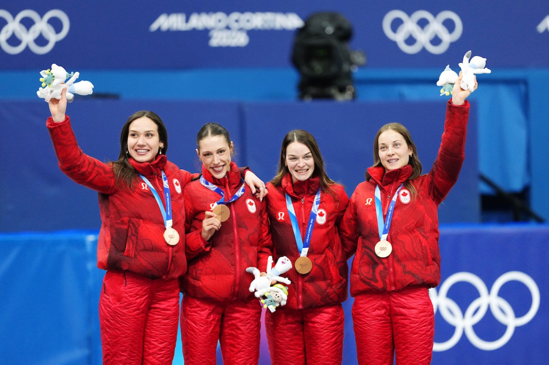 Team Canada, from left to right, Courtney Sarault, Florence Brunelle, Kim Boutin, and Danaé Blais celebrate winning bronze