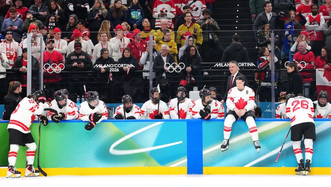 Team Canada'reacts near their bench following their loss to Team USA in the gold medal game of Women's Ice Hockey