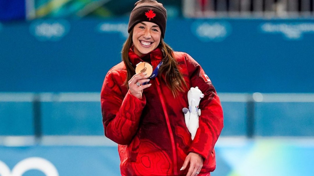 Team Canada's Valerie Maltais celebrates winning a bronze medal in women’s 1500m