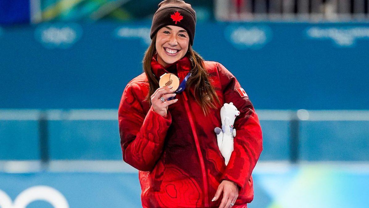 Team Canada's Valerie Maltais celebrates winning a bronze medal in women’s 1500m