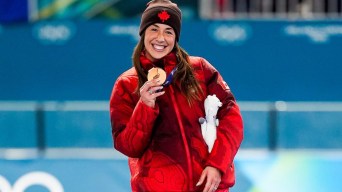 Team Canada's Valerie Maltais celebrates winning a bronze medal in women’s 1500m