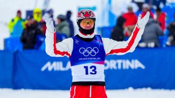 Team Canada’s Lewis Irving reacts after his jump in Men's Aerials finals