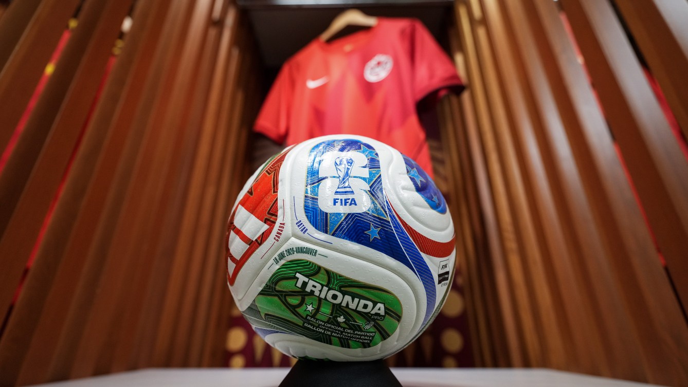 A Trionda match ball and a Canada soccer jersey are displayed in a locker in one of the team dressing rooms at B.C. Place stadium