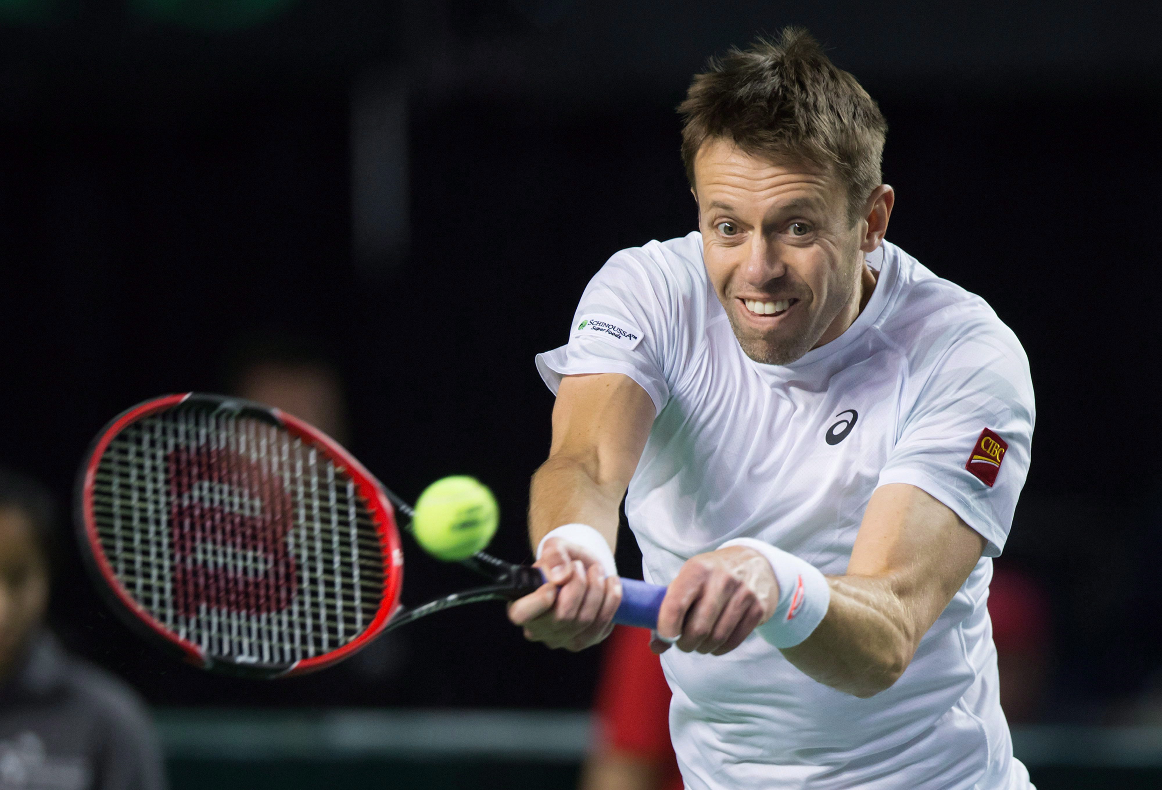 Canada's Daniel Nestor, of Toronto, Ont., playing with teammate Vasek Pospisil returns to Japan's Go Soeda and Yasutaka Uchiyama during a Davis Cup tennis world group first round doubles match in Vancouver, B.C., on Saturday March 7, 2015. THE CANADIAN PRESS/Darryl Dyck