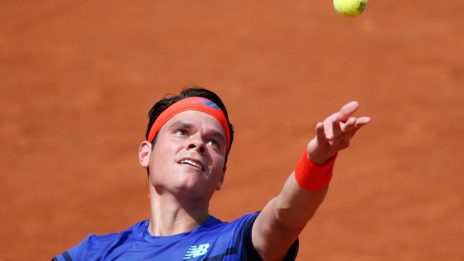 Milos Raonic contre le Slovaque Andrej Martin au troisième tour de Roland-Garros le vendredi 27 mai 2016 à Paris. (AP Photo/Alastair Grant)