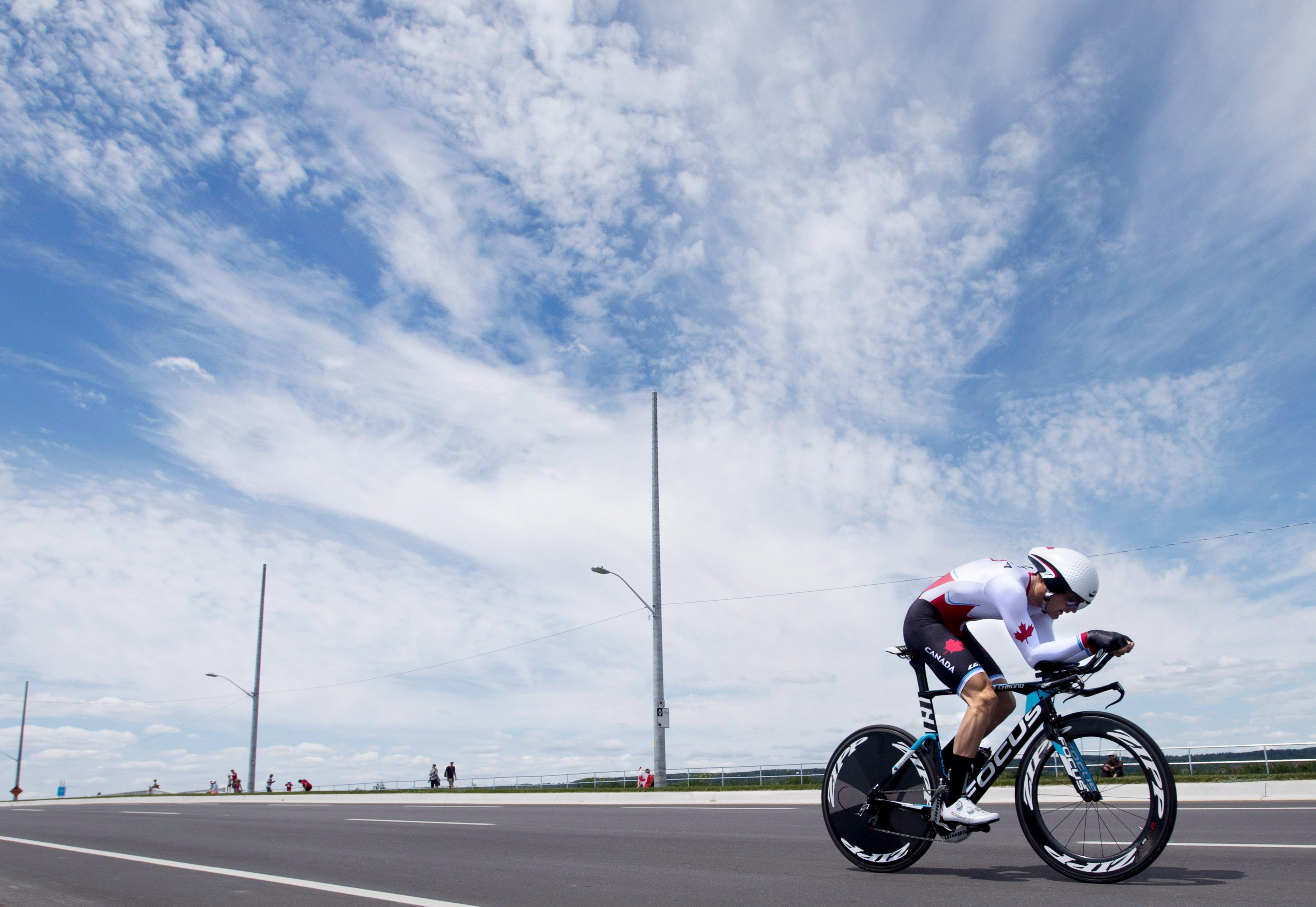 Hugo Houle of Canada rides his way to winning the gold medal in men's individual time trial road cycling at the 2015 Pan Am Games in Milton, Ont. on Wednesday, July 22, 2015. THE CANADIAN PRESS/Darren Calabrese