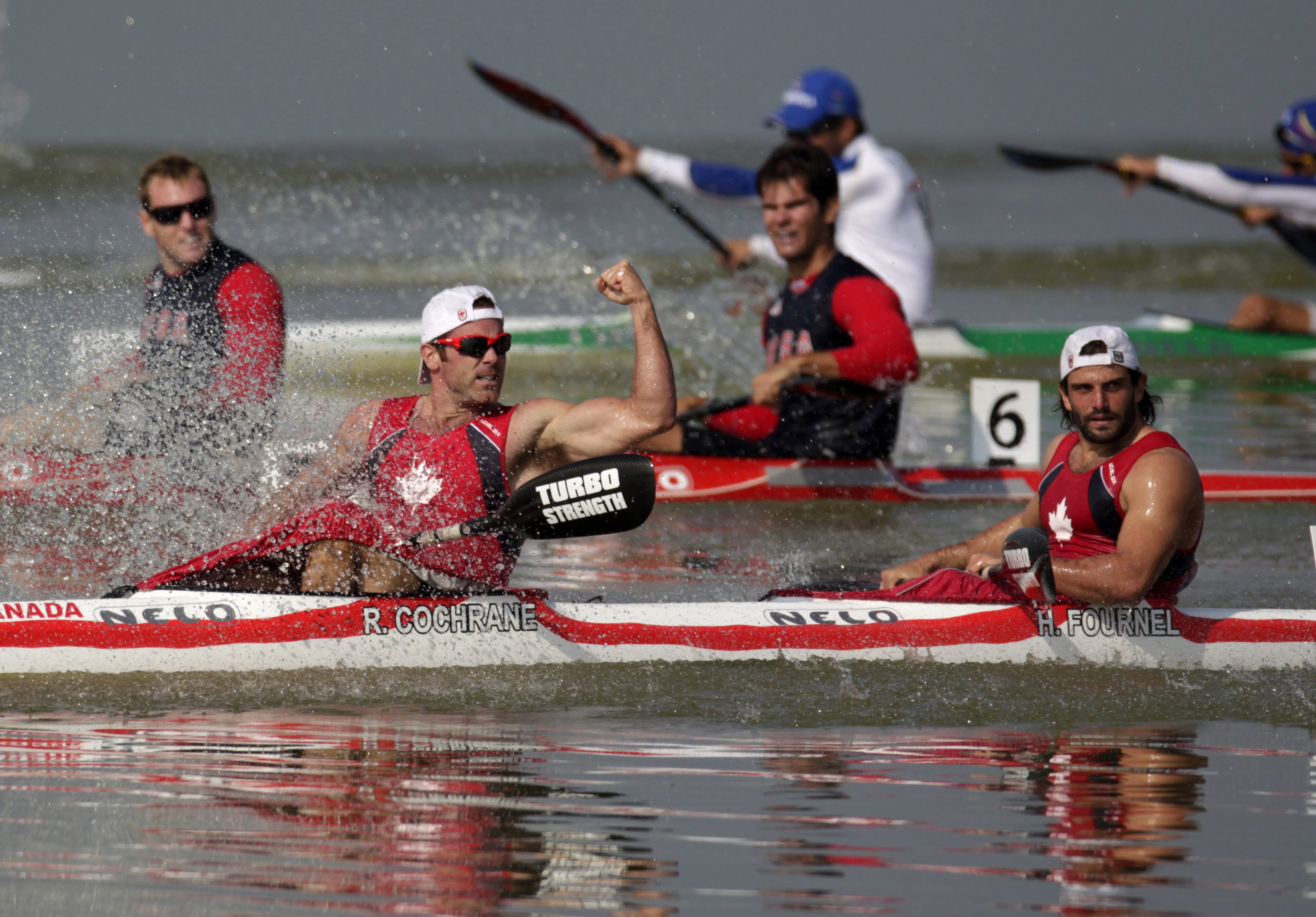 Gold medal winners Paul Cochrane, left, and Hugues Fournel from Canada cross the finish line as they win the men's double K2 200m kayak event at the Pan American Games in Ciudad Guzman, Mexico, Saturday Oct. 29, 2011. (AP Photo/Eduardo Verdugo)