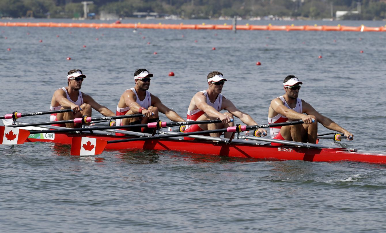 Julien Bahain, Robert Micael Gibson Will Dean, and Pascal Lussier, of Canada, compete in the men's quadruple scull heat heat during the 2016 Summer Olympics in Rio de Janeiro, Brazil, Saturday, Aug. 6, 2016. (AP Photo/Andre Penner)