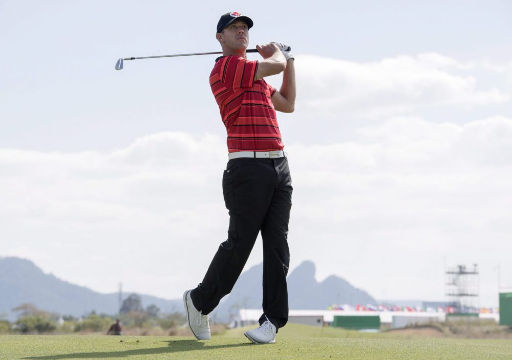 Canada's Graham DeLaet watches an approach shot in the first round at the 2016 Summer Olympics in Rio de Janeiro, Brazil, Thursday, Aug. 11, 2016. THE CANADIAN PRESS/Frank Gunn