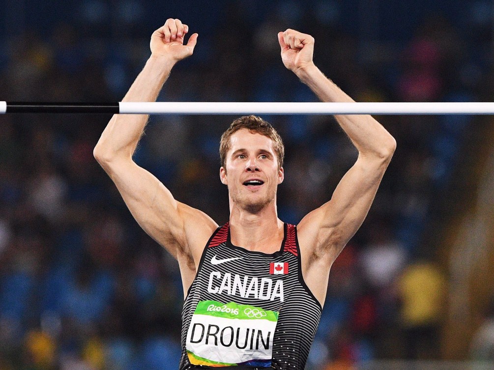 Canada's Derek Drouin celebrates after clearing his fifth jump during the men's high jump final at the 2016 Summer Olympics in Rio de Janeiro, Brazil, Tuesday, August 16, 2016. THE CANADIAN PRESS/Sean Kilpatrick