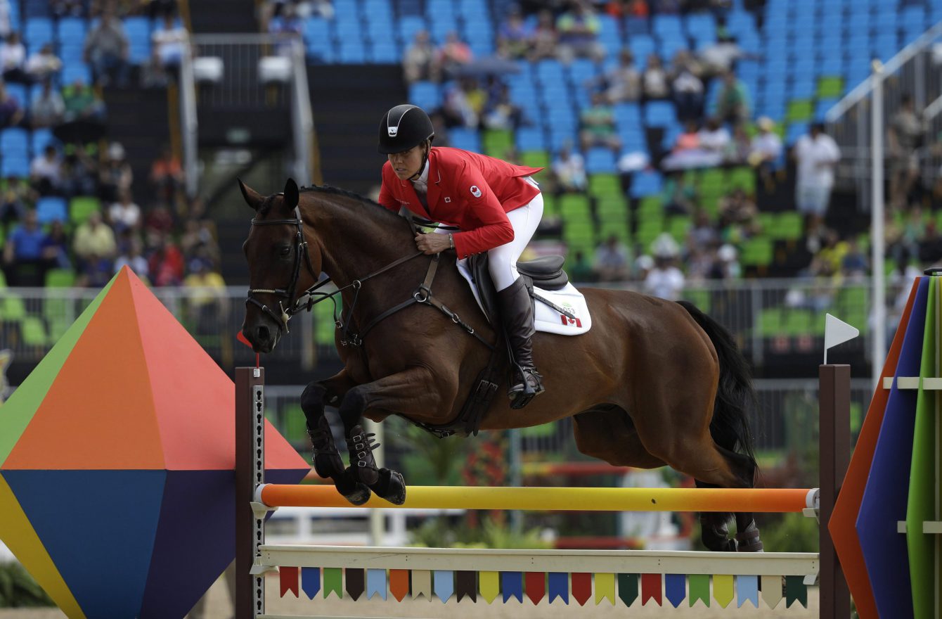 Rebecca Howard d'Équipe Canada participe à l'épreuve par équipe de sports équestre aux Jeux olympiques de Rio, le 9 août 2016. Photo : AP/John Locher